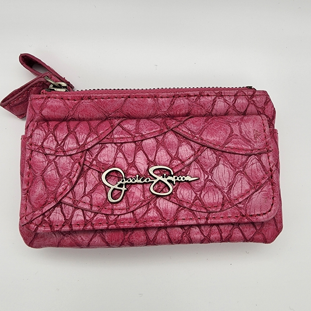 Jessica Simpson little pink wallet. Everything is pretty in pink.  Gently used